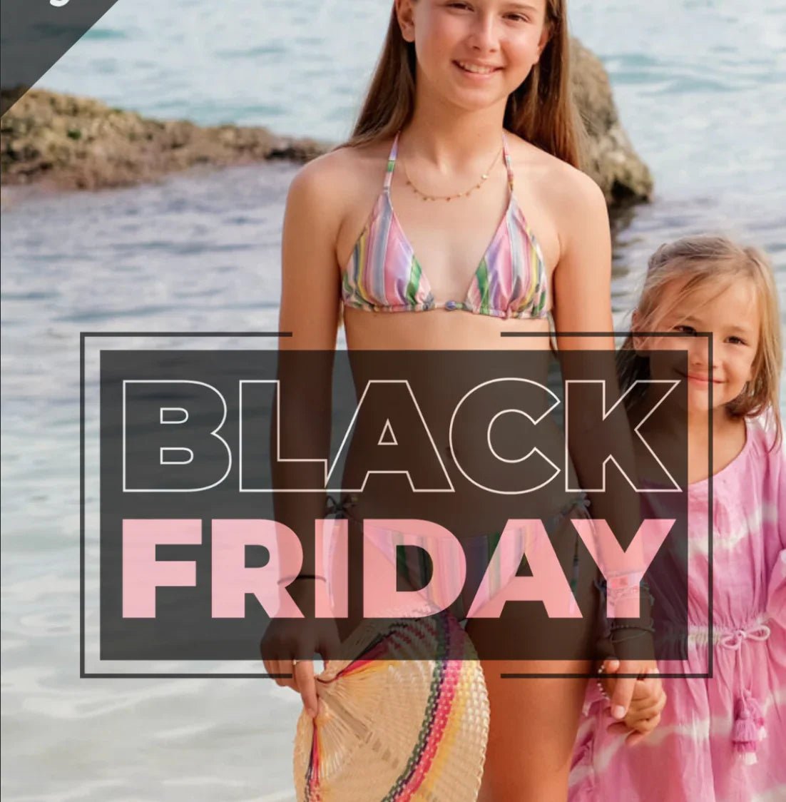 Girls in beachwear standing by the sea, holding hands, Black Friday sale text overlay