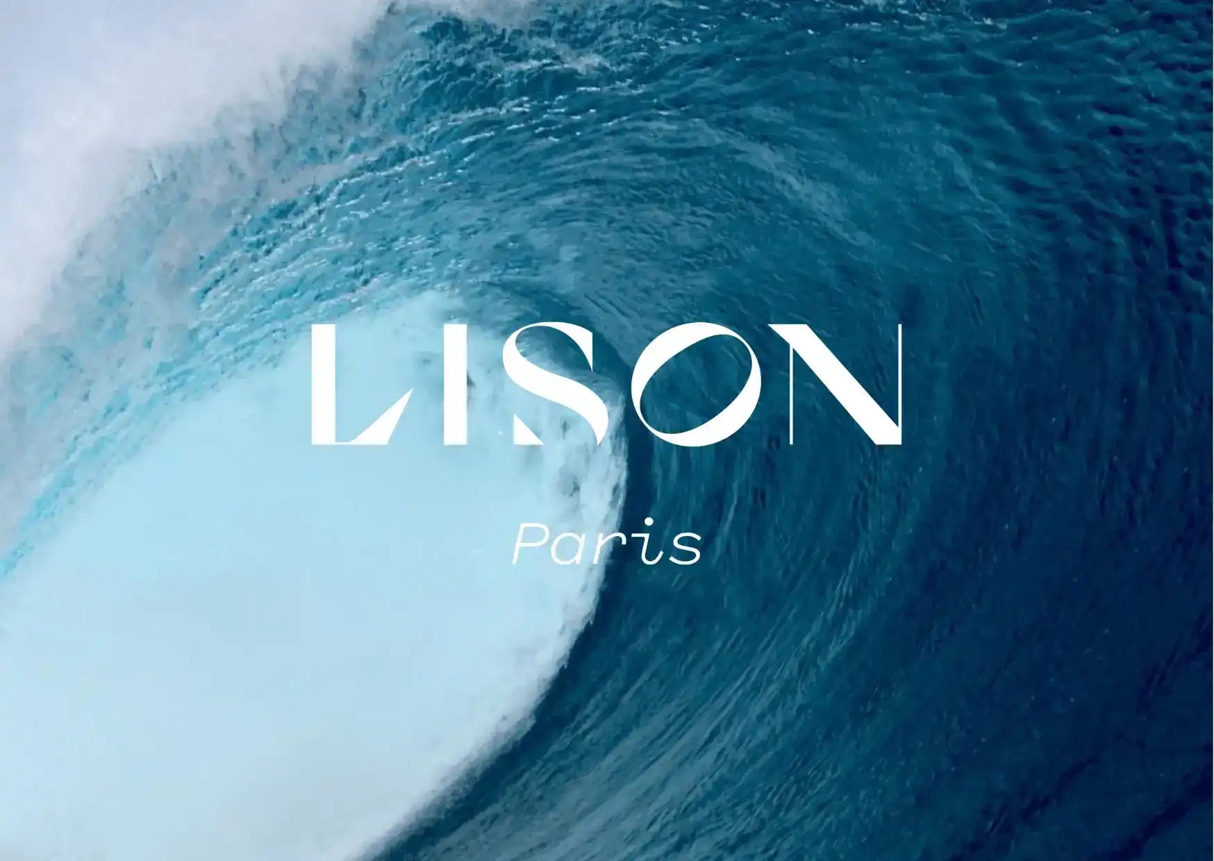Large ocean wave with bold white text Lison Paris over the water