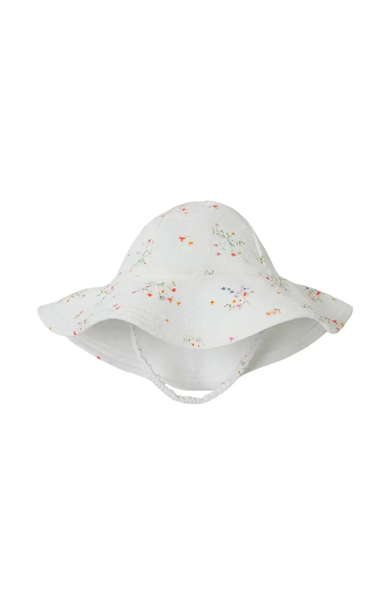 Girls' white floral sun hat with wide brim and strap, Lison Paris beachwear accessory