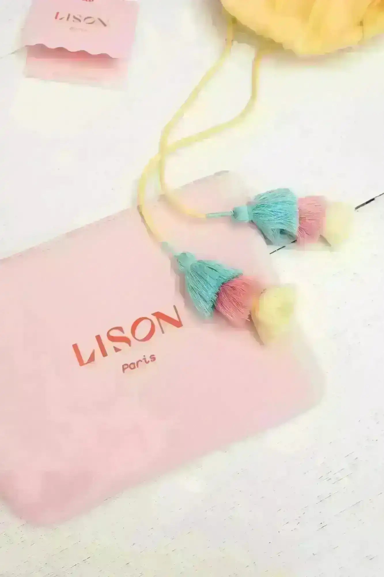 Lison Paris pink pouch with pastel tassels, girls swimwear accessory on white background