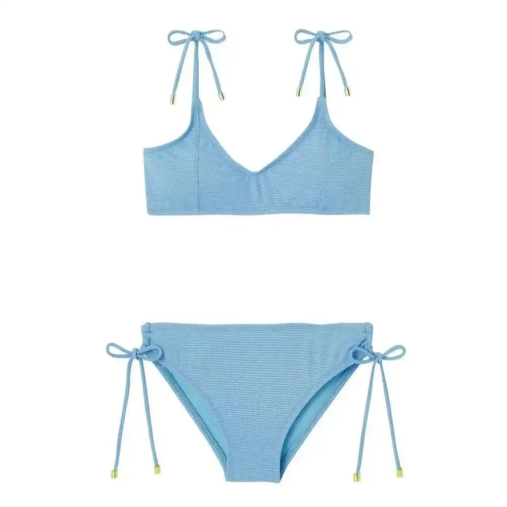 Light blue girls' two-piece swimsuit with textured fabric and side tie details by Lison Paris