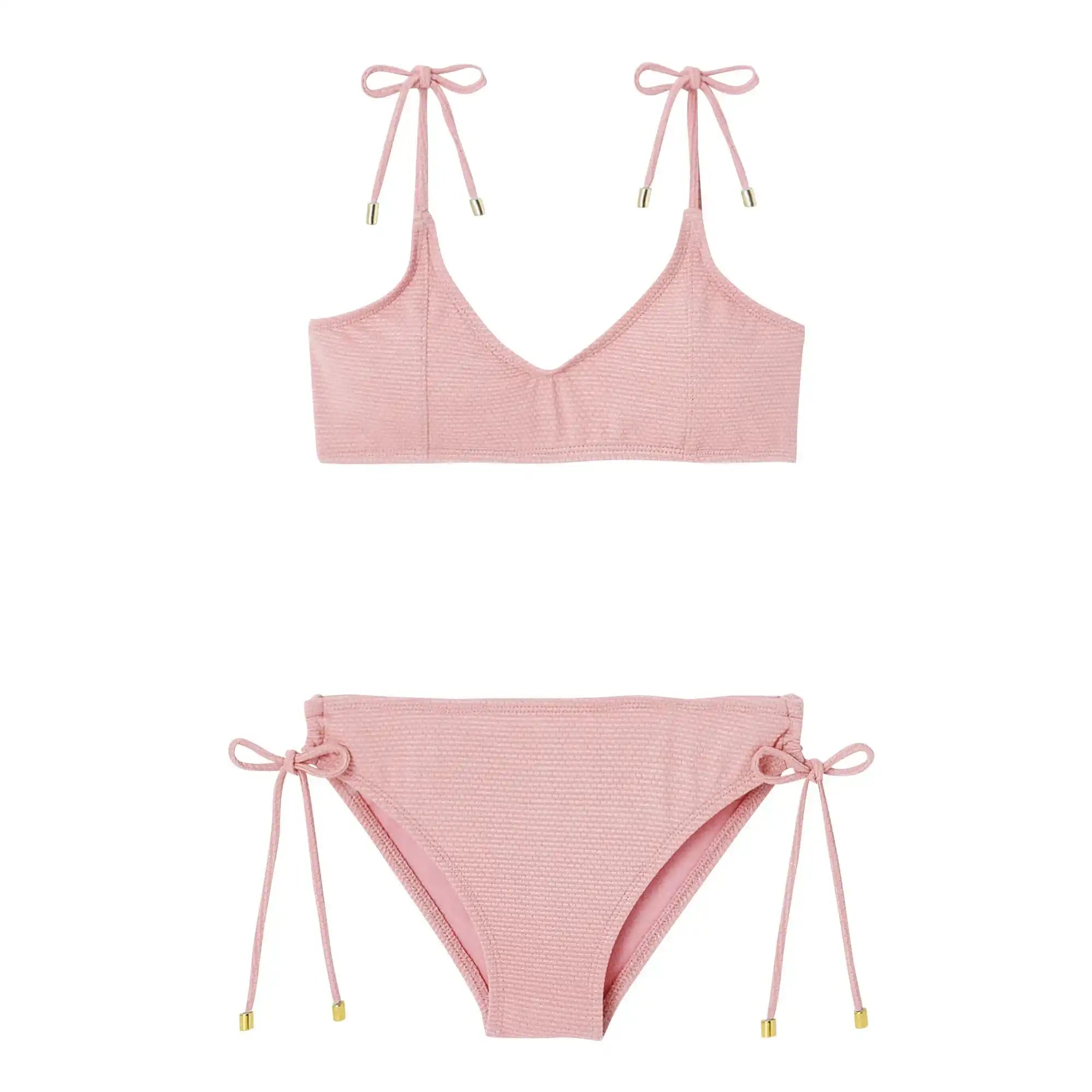 Light pink girls' two-piece swimsuit with textured fabric, shoulder and side bows, Lison Paris