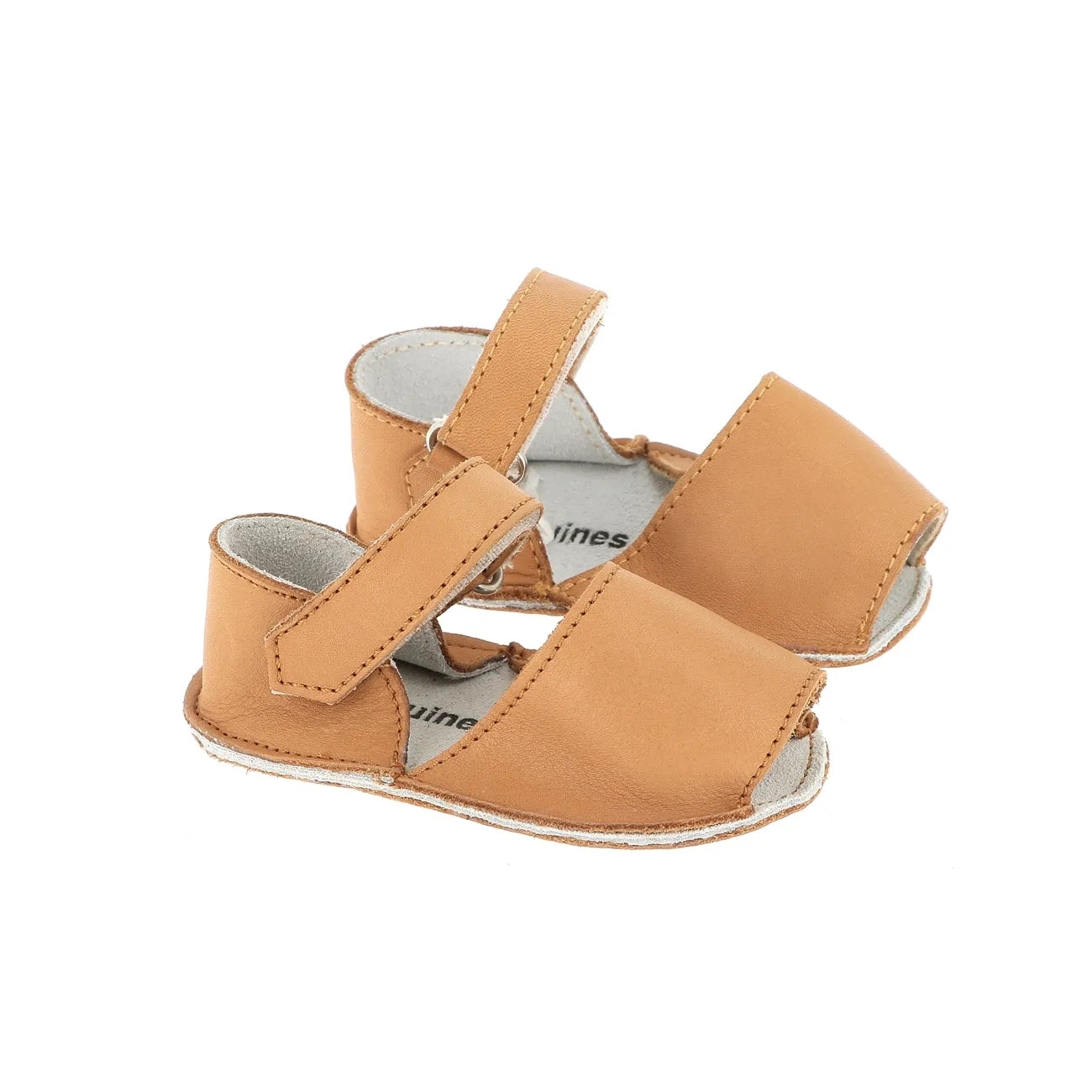 Natural tan leather baby sandals with open toes and adjustable straps on white background