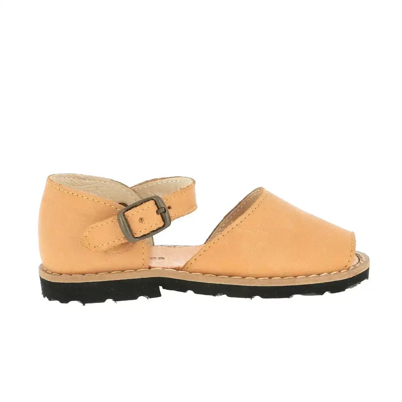 Natural leather buckle sandal for kids with black sole on white background